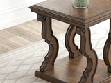 Close-up of ornate apron and scrolled leg detail on Maylee end table