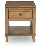 Close-up of dark bronze-tone drawer pull on Sharlance table