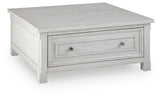 Robbinsdale Antique White Lift-Top Coffee Table angled view
