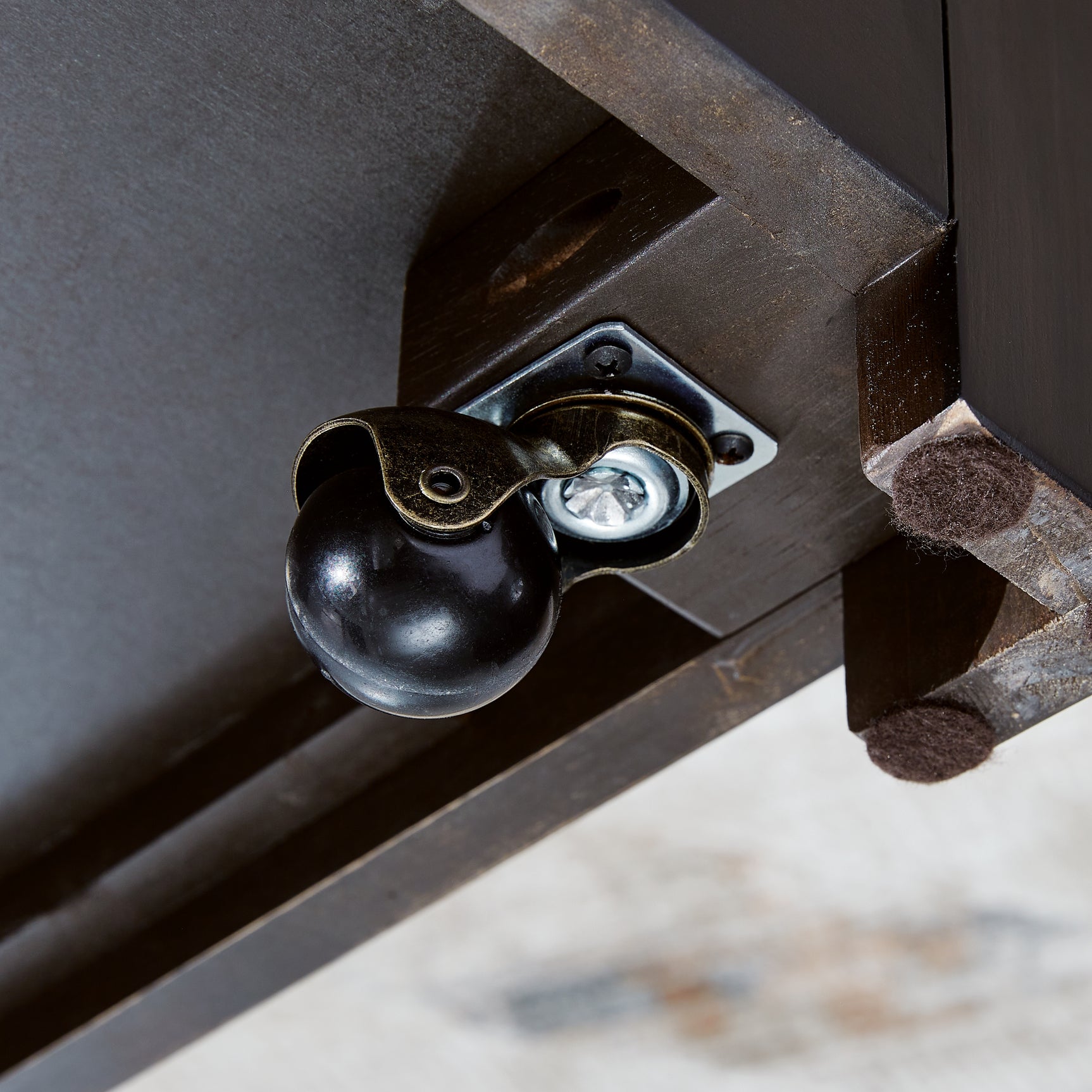 Close-up of caster under Drazmine coffee table