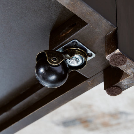 Close-up of caster under Drazmine coffee table