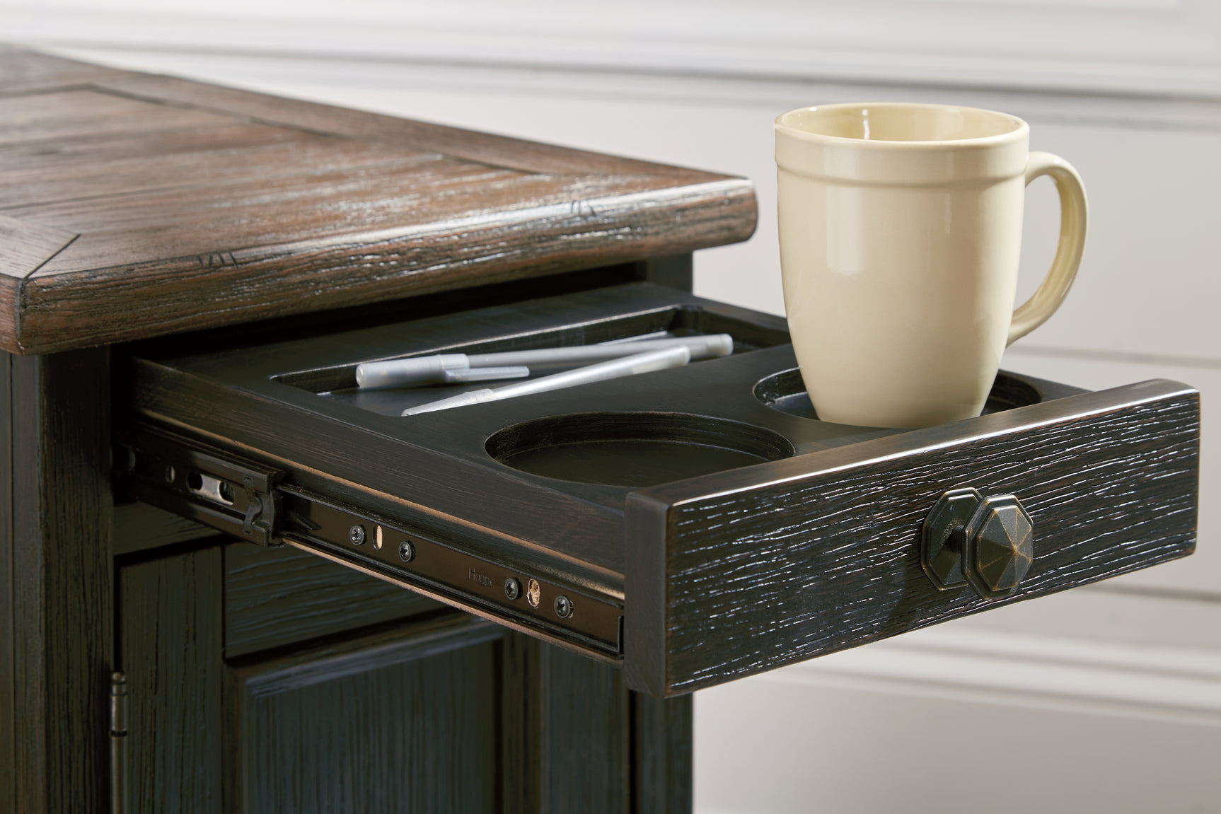 Tyler Creek grayish brown and black coffee table with lift top and end table