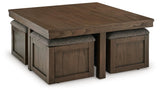 Boardernest coffee table with stools pushed in, showing rich wood grain finish