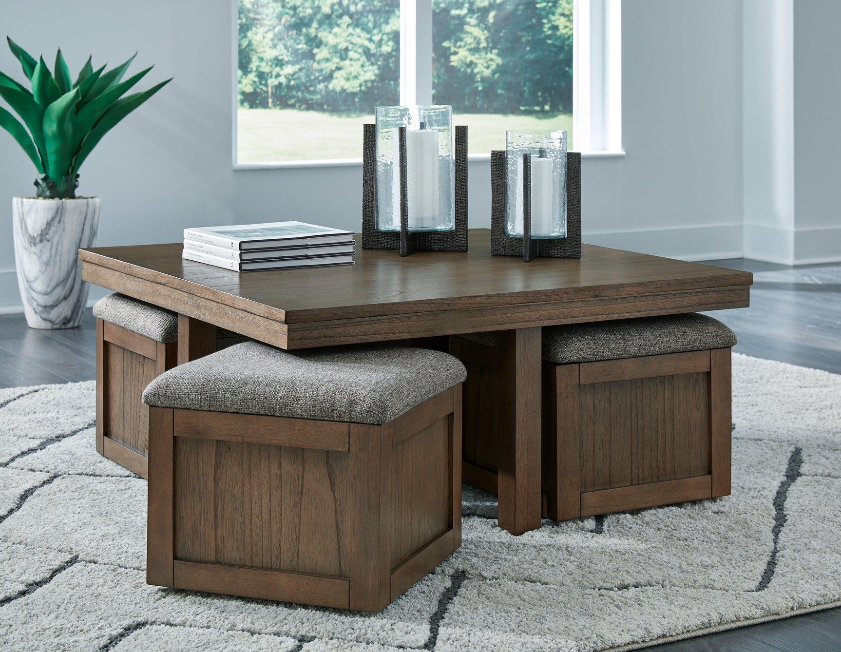 Boardernest coffee table with 4 stools pulled out showing caster wheels