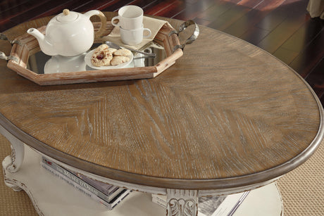 Realyn Oval White Brown Coffee Table top surface