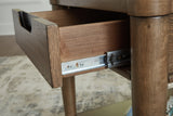 Roanhowe brown coffee table with two end tables set