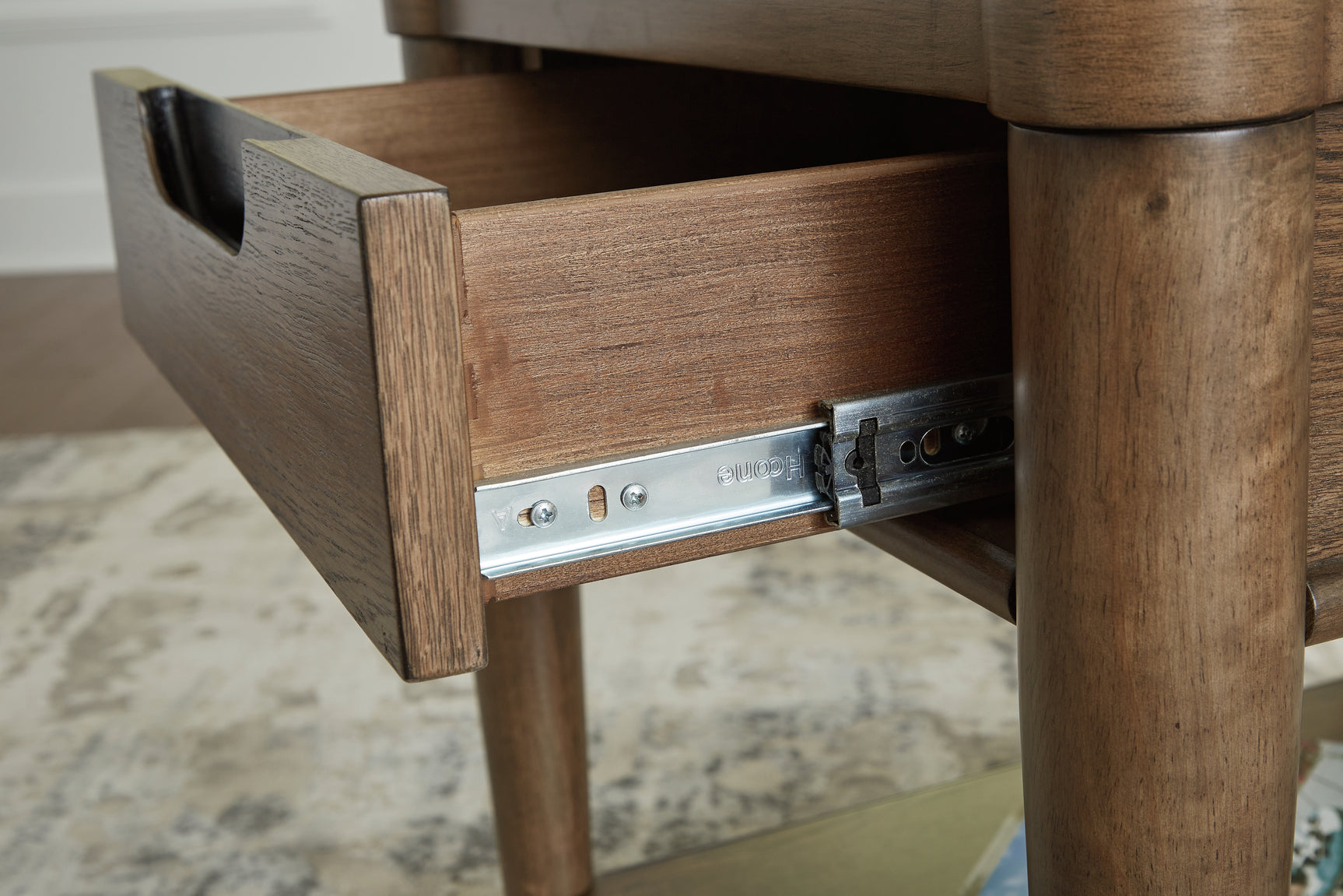 Roanhowe brown coffee table with two end tables set