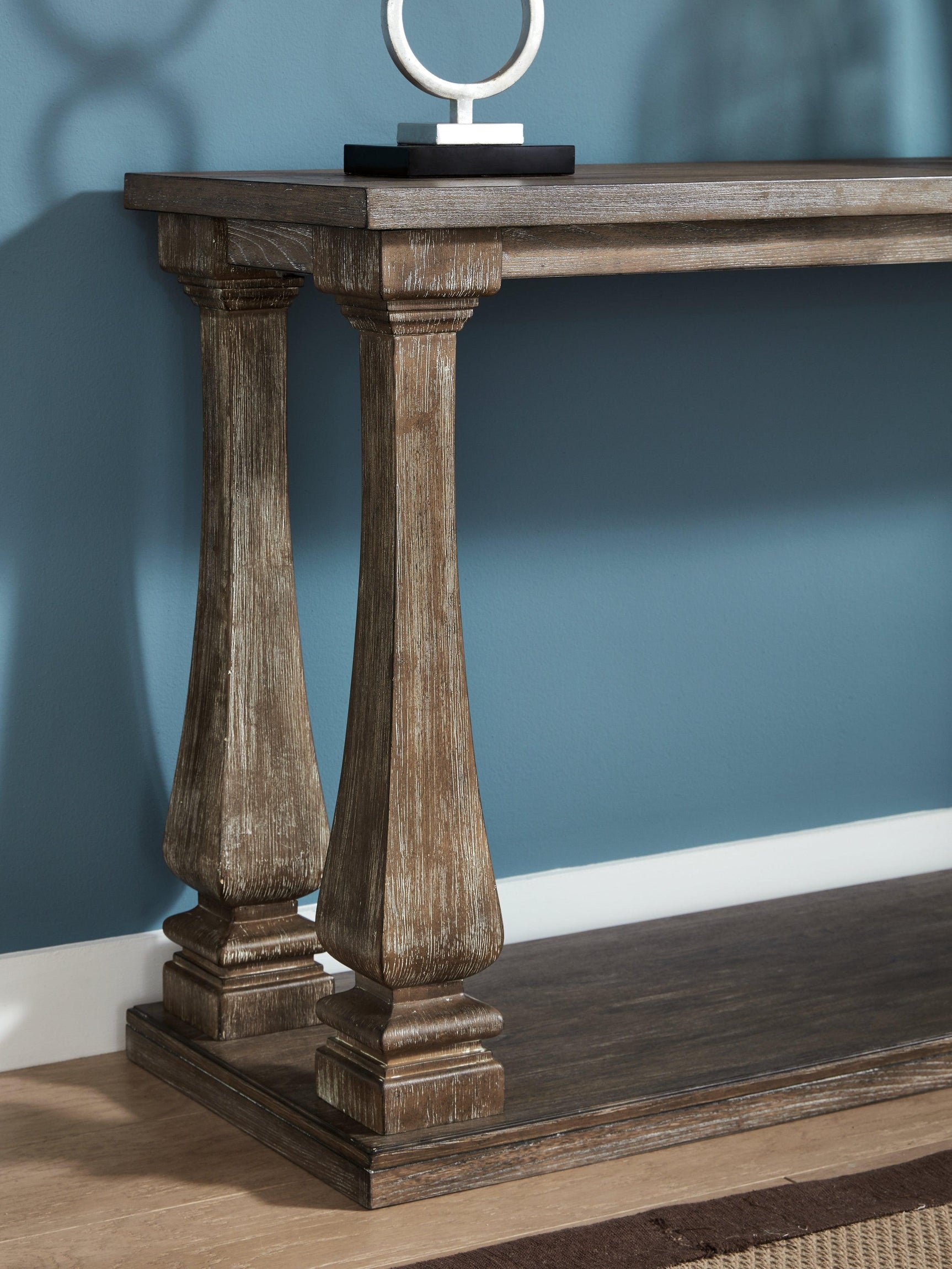 Close-up detail of elm veneer and weathered gray finish on Johnelle Sofa Table