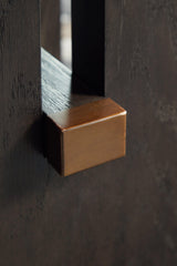 Detailed view of marble tabletop edge and brass accents on Burkhaus end table