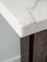 Side profile of Burkhaus sofa table with marble top and oak base