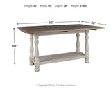 Close-up of weathered gray top and vintage white base finish on Havalance table