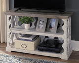Decorated Havalance sofa console table with books and accessories