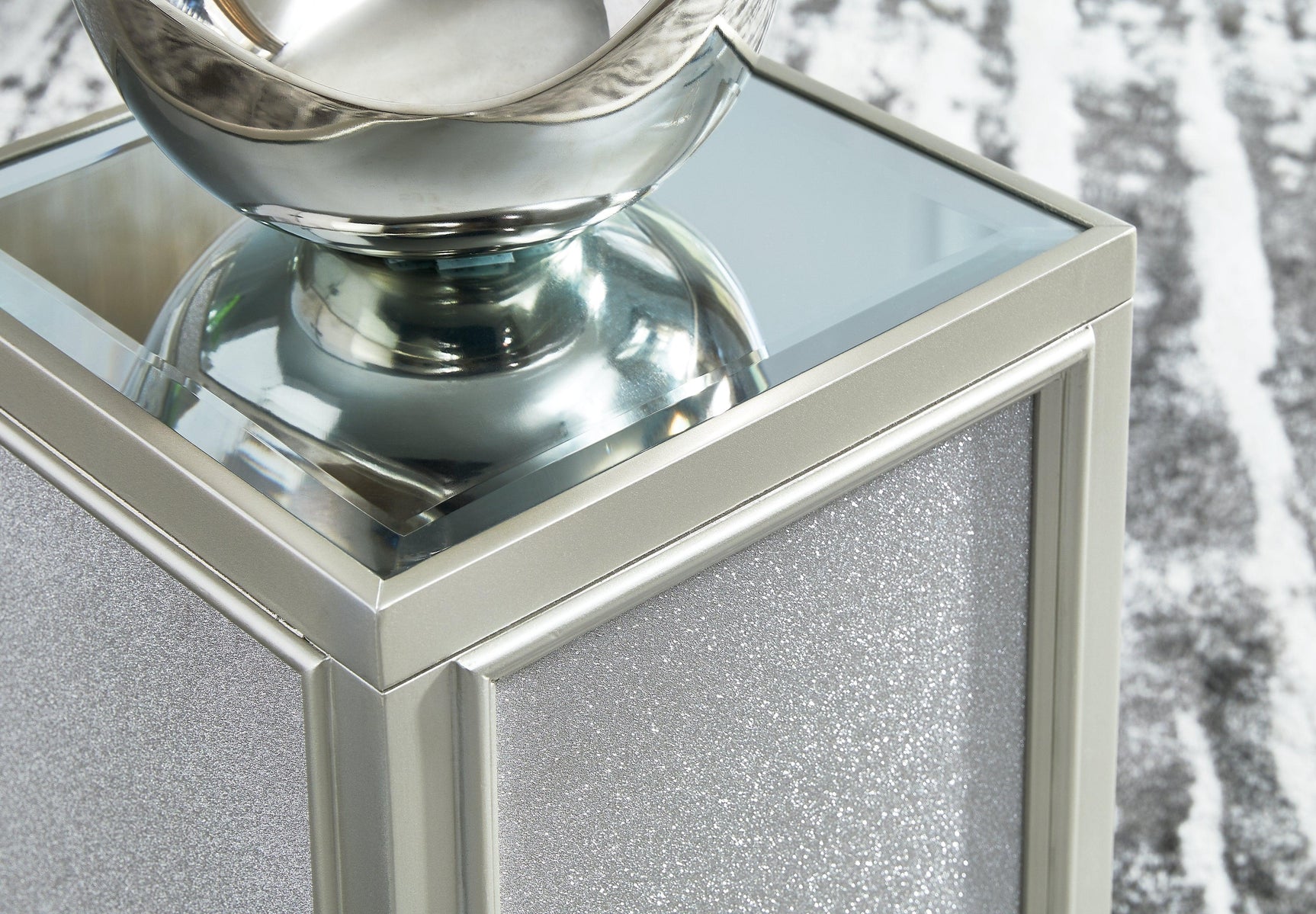 Detail of silver finish and textured laminate on Traleena end table