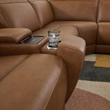 Pop-out cup holders on armrest