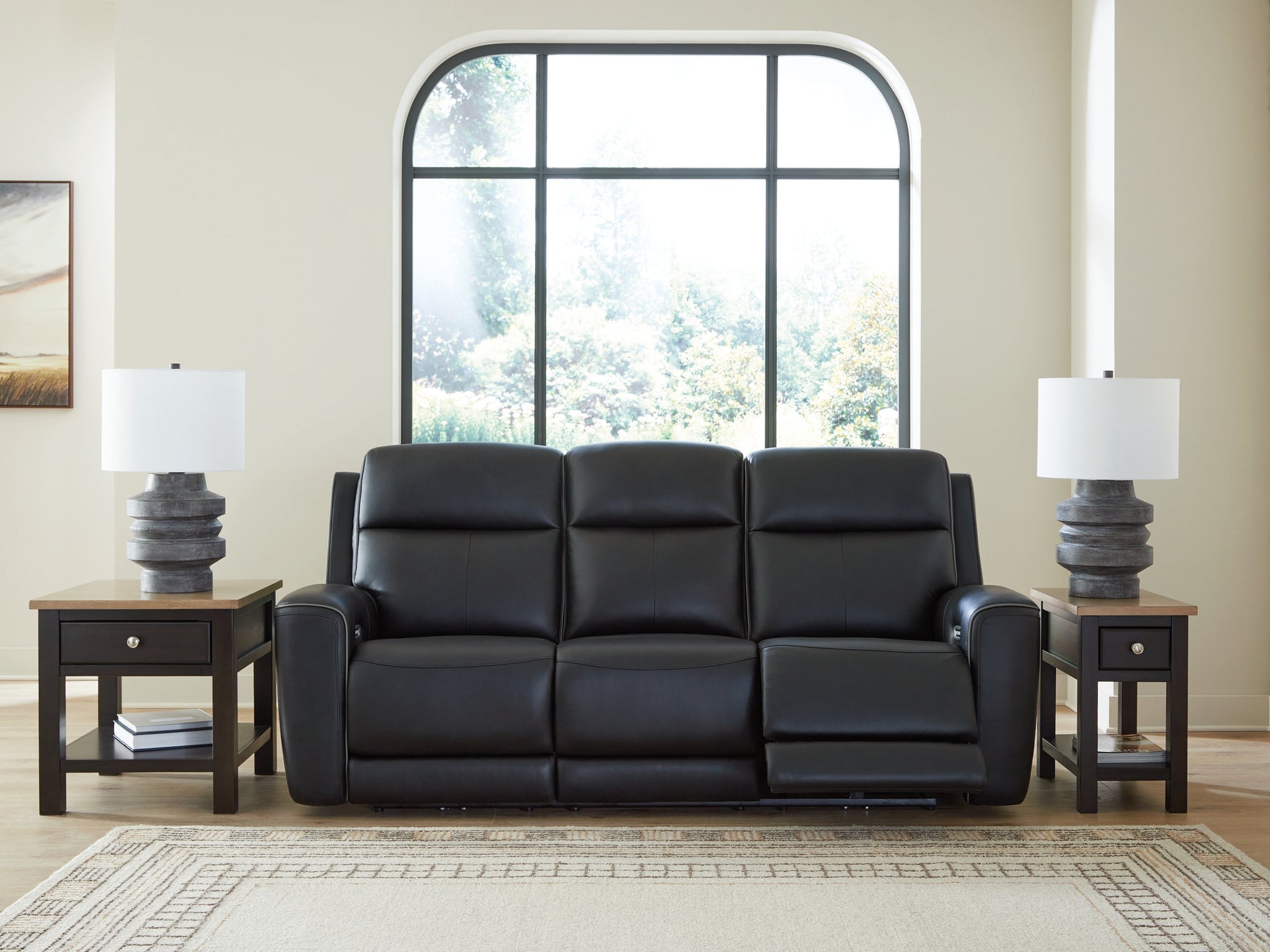 Sofa showing wireless charging pad on drop-down table