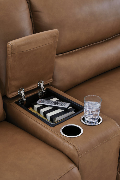 Storage console close-up with cup holders and hidden compartment