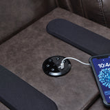 Detail of USB port and wireless speaker on drop-down table