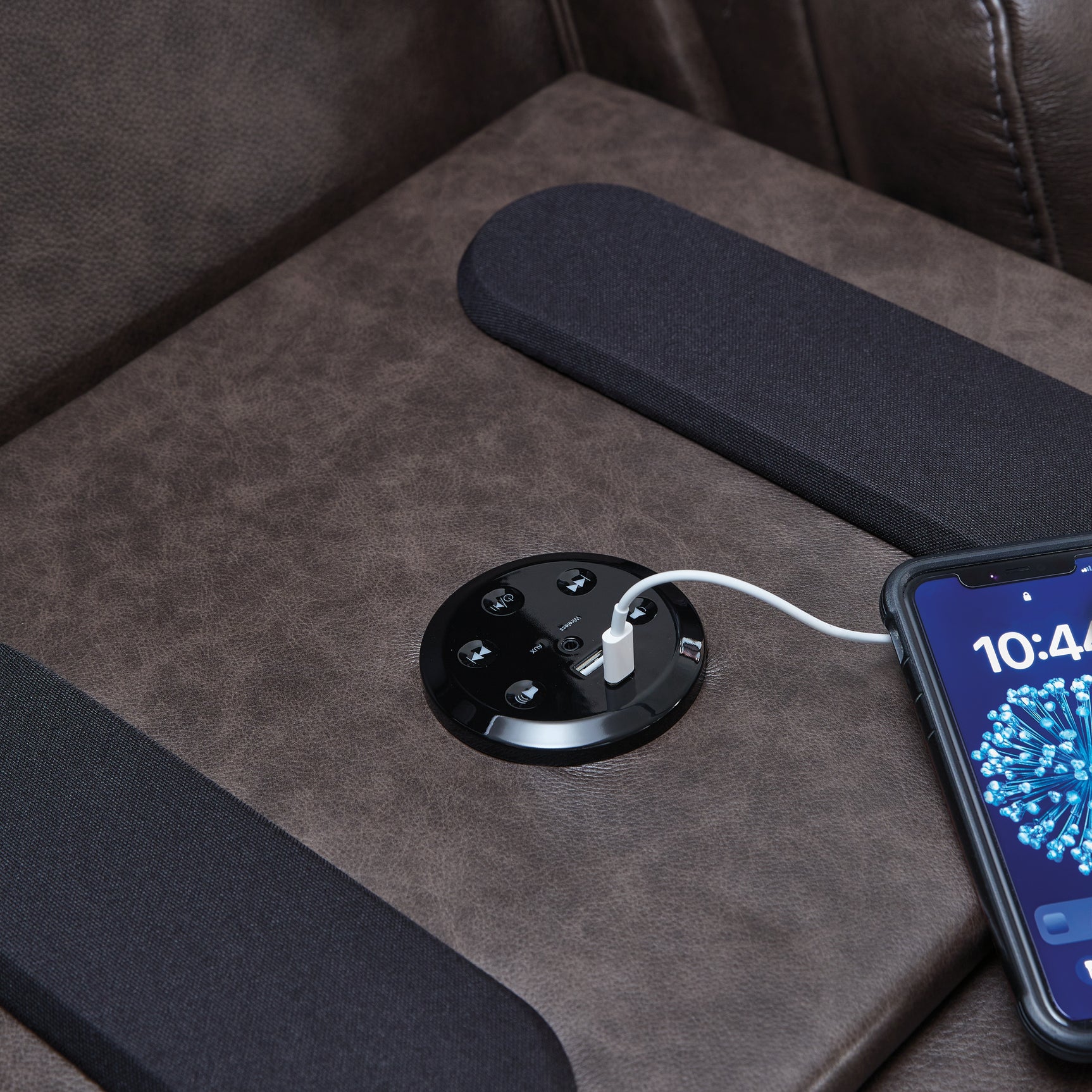 Detail of USB port and wireless speaker on drop-down table
