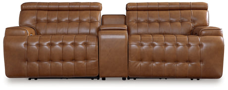 Power reclining sectional loveseat closeup showing leather upholstery and console features