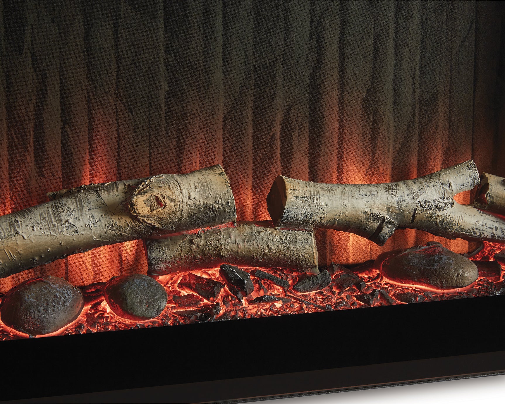 Close-up of faux birch logs detail in fireplace insert