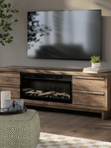 Detail of faux birch log set in fireplace