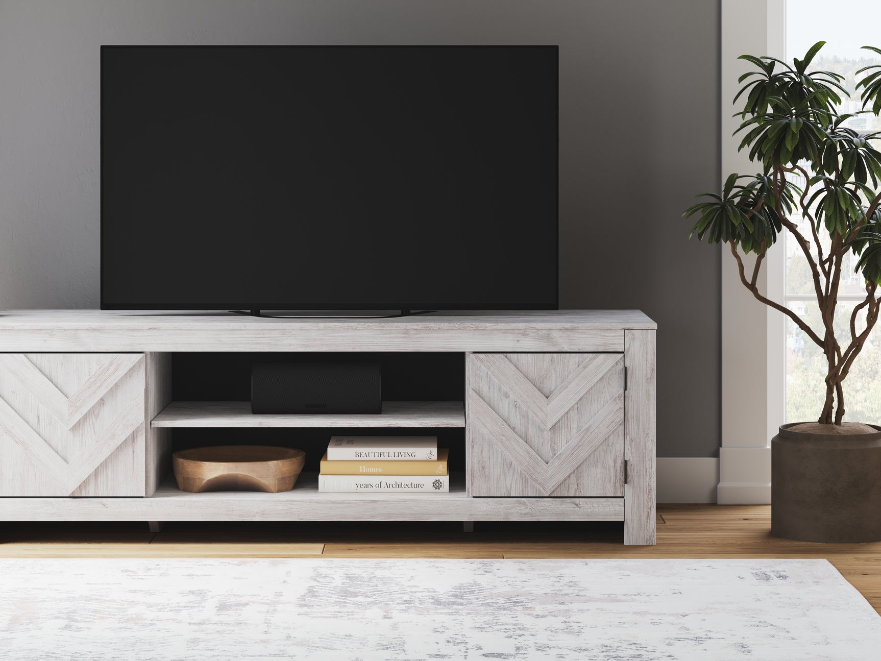Open cabinet view of Cayboni TV stand with media devices