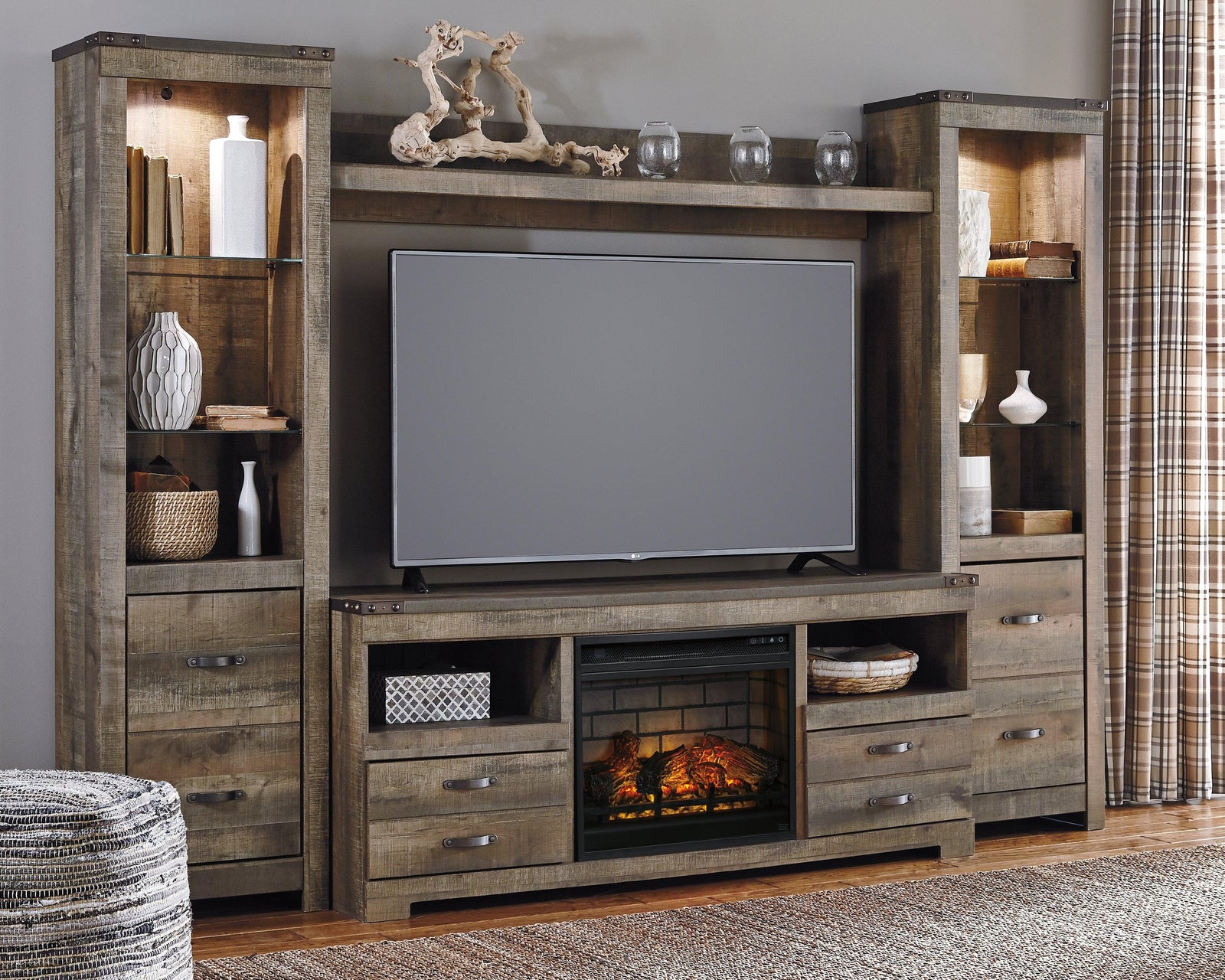 Trinell Brown 4-Piece Entertainment Center With Electric Fireplace - Ella Furniture