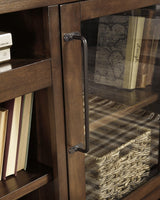 Close-up of oiled walnut-tone finish and dark bronze hardware