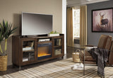 Starmore collection brown TV stand with electric fireplace in room setting