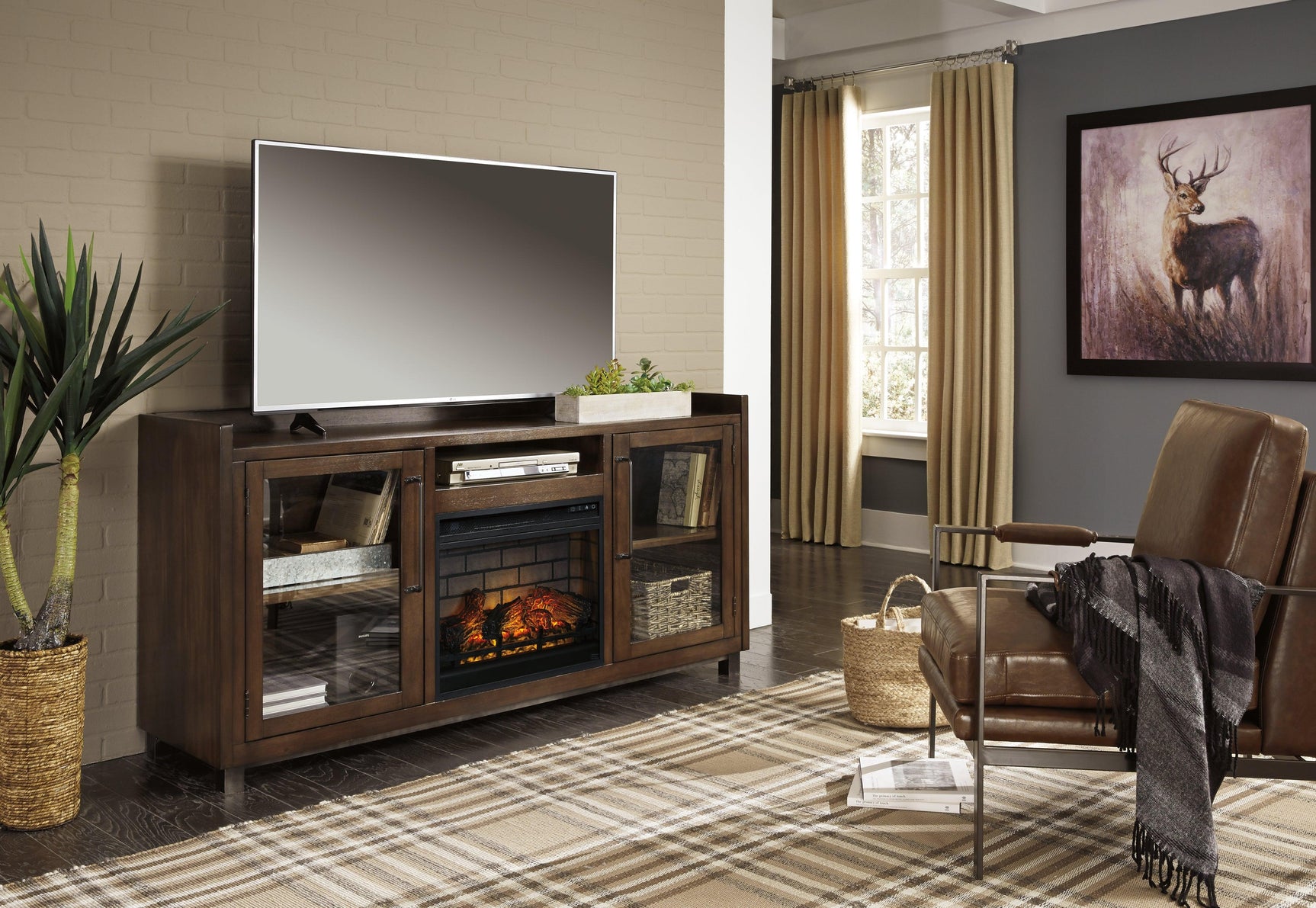 Starmore TV stand with fireplace lit from front angle