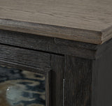 Close-up of Tyler Creek TV stand door and bronze-tone knob