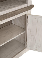 Open door showing storage shelf inside pier cabinet