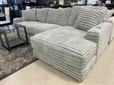 Side view of Kelly oversized gray corduroy sectional sofa with cupholders