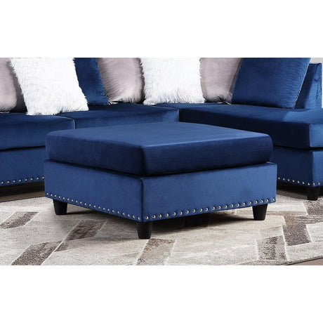 Blue velvet upholstered ottoman with nailhead trim, front angle view