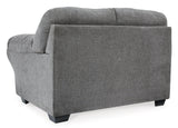 Side angle showing upholstery texture on loveseat