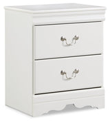 side view of white sleigh bed