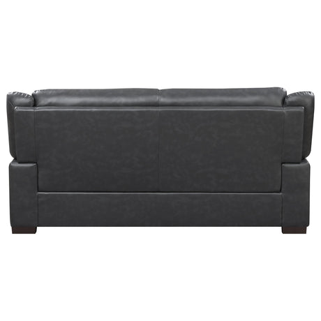 Detail of brown faux leather upholstery on Arabella set