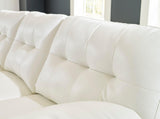 Side perspective of Ashley RAF Chaise sectional sofa with white legs