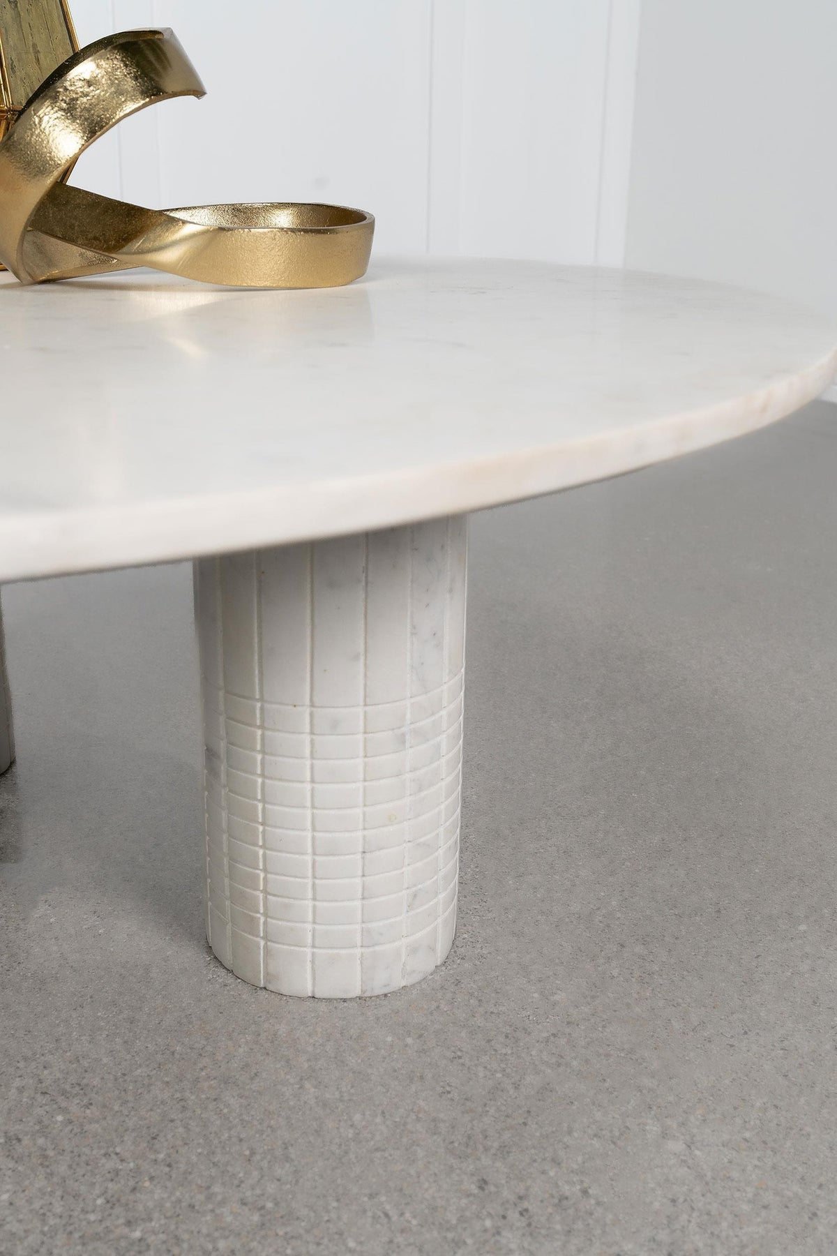 Side angle of Astoria round marble coffee table with MDF base