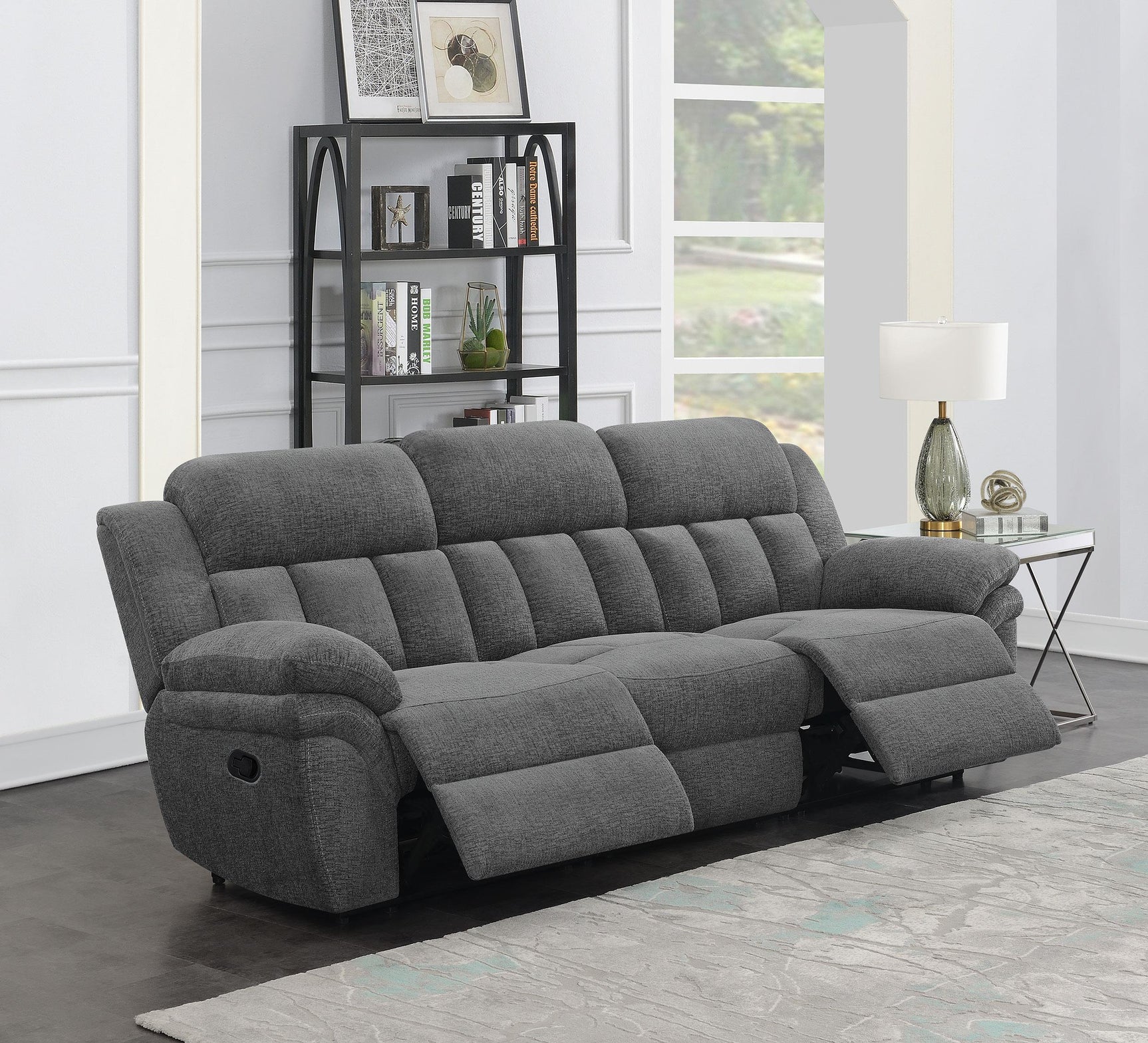 Bahrain charcoal upholstered dual recliner sofa side view with reclined seat