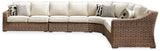 Curved corner sectional piece with two decorative throw pillows