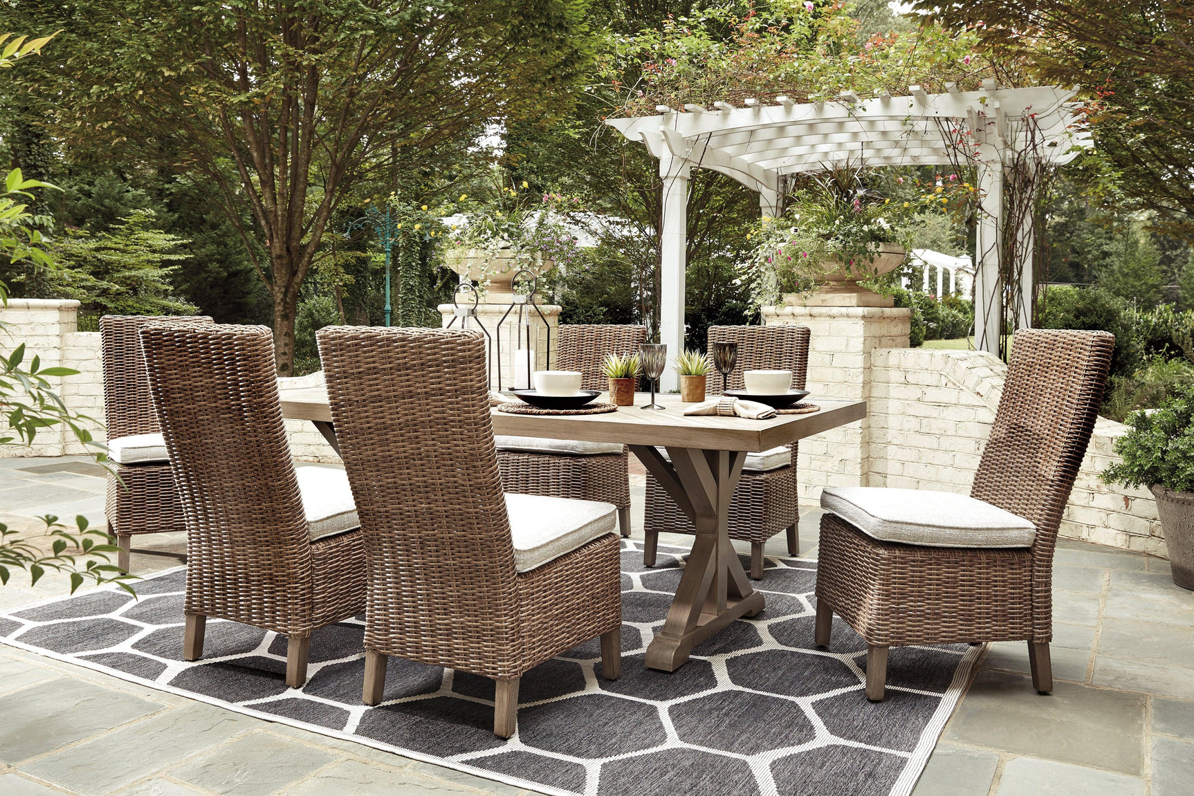Beige resin wicker chair with plush cushion included