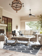 Outdoor sofa set styled on patio with beige cushions