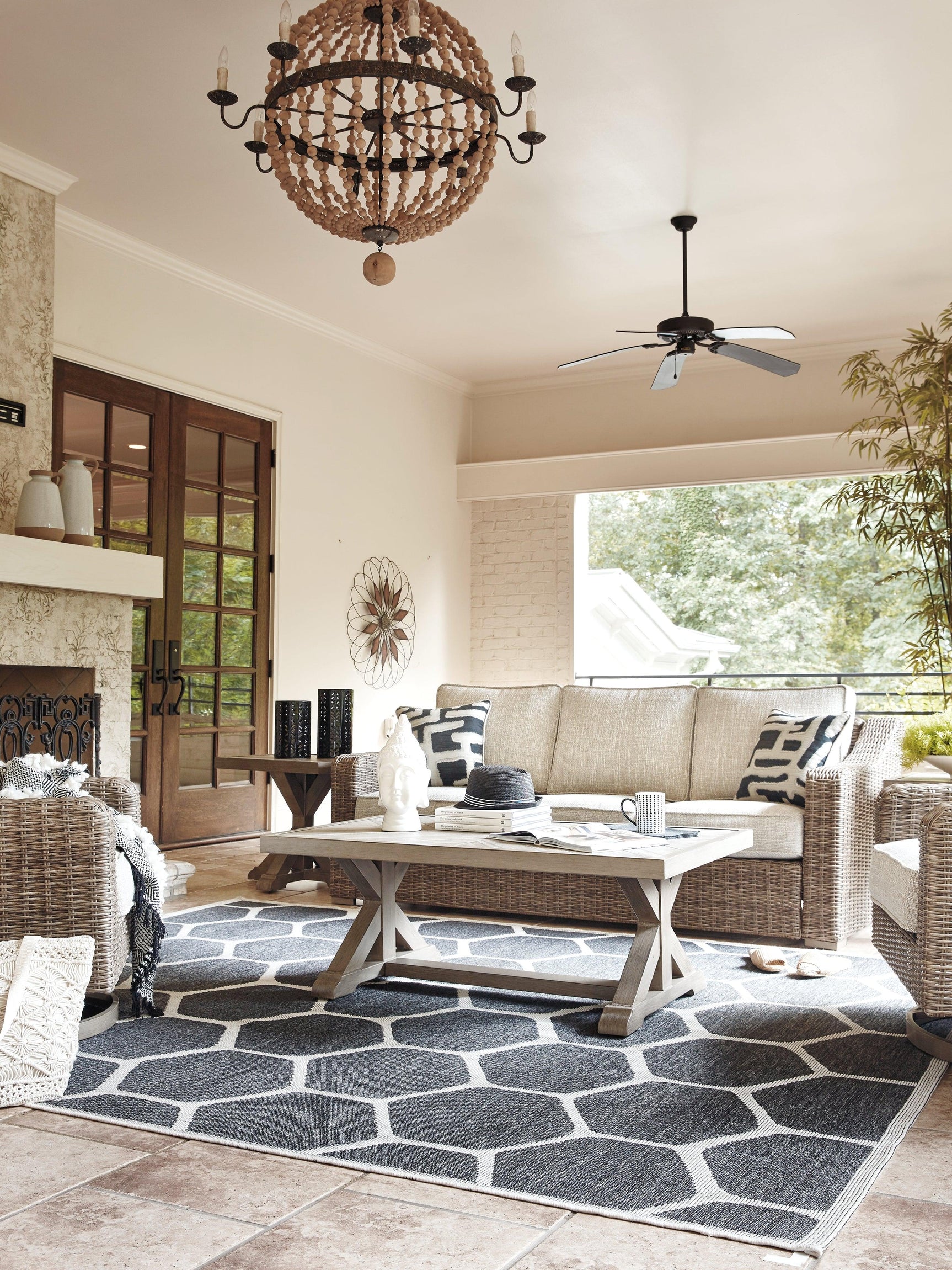 Outdoor sofa set styled on patio with beige cushions