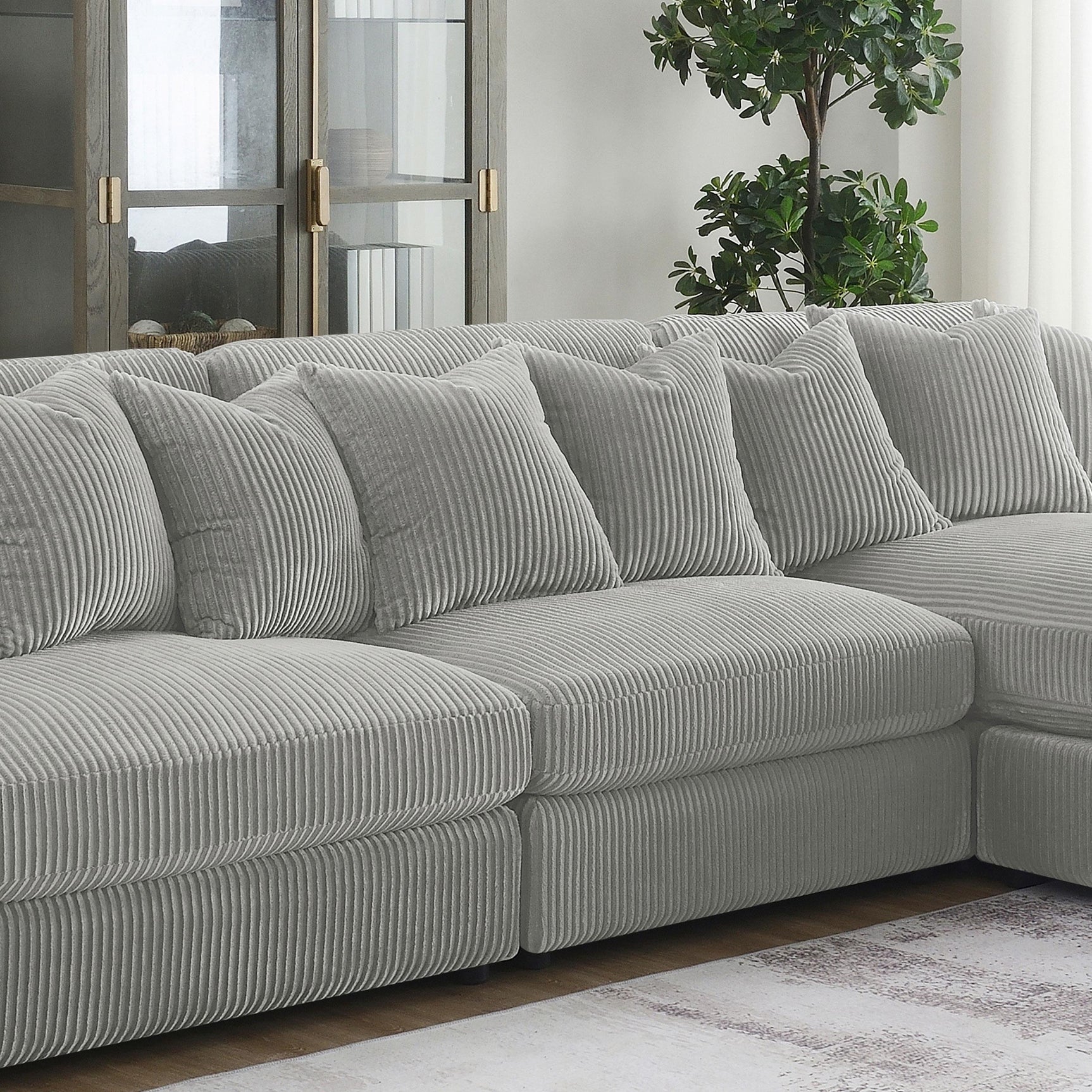 Side view of Blaine Upholstered Armless Chair in fog