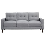 Close-up detail of tufted fabric and track arms on Bowen sofa set