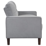 Close detail of tufted upholstery on Bowen sofa arm