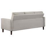 Close-up of beige fabric upholstery on Bowen sofa set