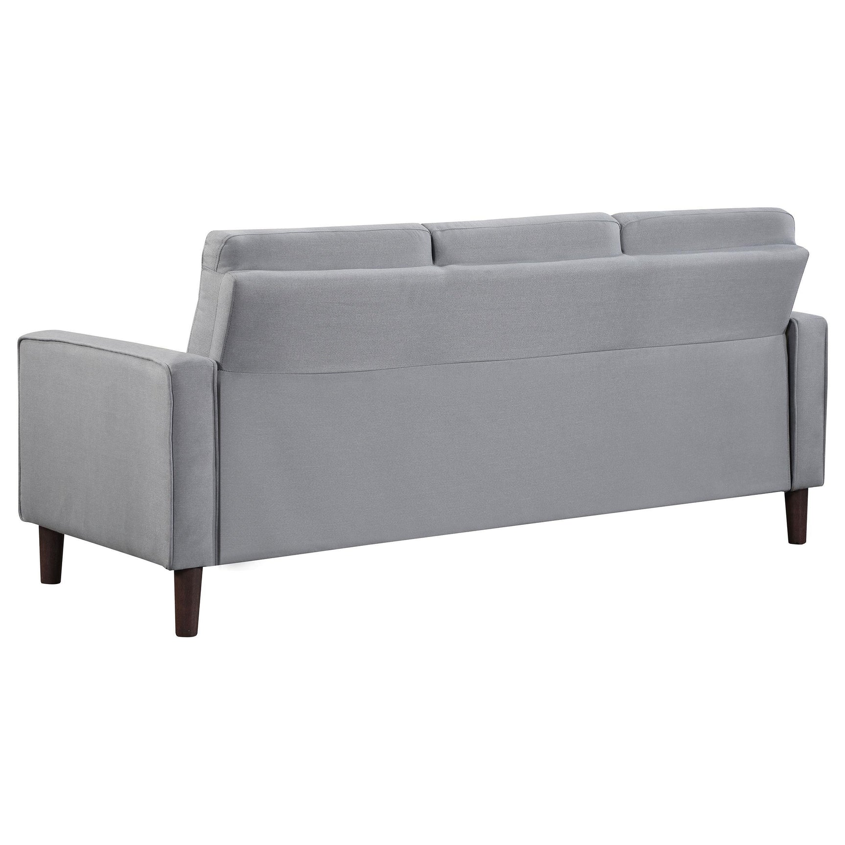 Grey upholstered loveseat front view with tufted cushions