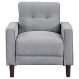 Close-up of tufted stitching detail on loveseat cushion